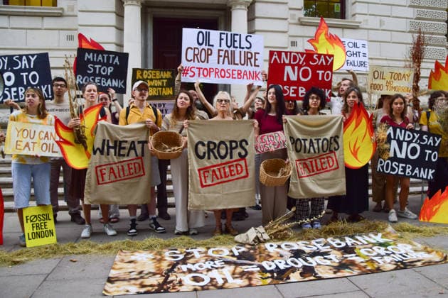August 17, 2026, London, England, United Kingdom: Climate activists from the group Fossil Free London gather outside the Treasury in Westminster in protest against Rosebank, as the public consulation on the North Sea oil and gas field concludes. The activists highlighted crop failures amidst the ongoing drought, heatwaves and fires. London United Kingdom - ZUMAv130 20260817_zip_v130_035 Copyright: xVukxValcicx