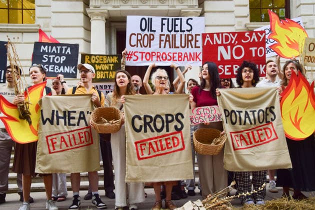 August 17, 2026, London, England, United Kingdom: Climate activists from the group Fossil Free London gather outside the Treasury in Westminster in protest against Rosebank, as the public consulation on the North Sea oil and gas field concludes. The activists highlighted crop failures amidst the ongoing drought, heatwaves and fires. London United Kingdom - ZUMAv130 20260817_zip_v130_036 Copyright: xVukxValcicx