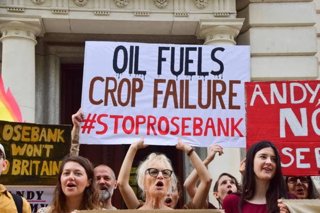 August 17, 2026, London, England, United Kingdom: Climate activists from the group Fossil Free London gather outside the Treasury in Westminster in protest against Rosebank, as the public consulation on the North Sea oil and gas field concludes. The activists highlighted crop failures amidst the ongoing drought, heatwaves and fires. London United Kingdom - ZUMAv130 20260817_zip_v130_038 Copyright: xVukxValcicx