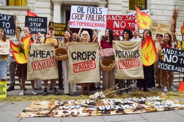 August 17, 2026, London, England, United Kingdom: Climate activists from the group Fossil Free London gather outside the Treasury in Westminster in protest against Rosebank, as the public consulation on the North Sea oil and gas field concludes. The activists highlighted crop failures amidst the ongoing drought, heatwaves and fires. London United Kingdom - ZUMAv130 20260817_zip_v130_039 Copyright: xVukxValcicx