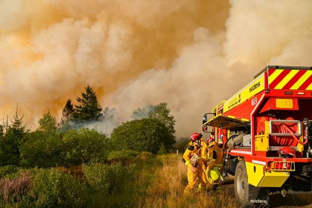 ATTENTION EDITORS - HANDOUT PICTURES - MANDATORY CREDIT - EDITORIAL USE ONLY - Handout pictured distributed shows Firemen in action as a fire rages in the Hautes Fagnes (High Fens) nature reserve, on Monday 17 August 2026. The fire started on August 14th and 2700 hectares (on a total of 4500) are impacted.  IMAGESxVHP 183602836