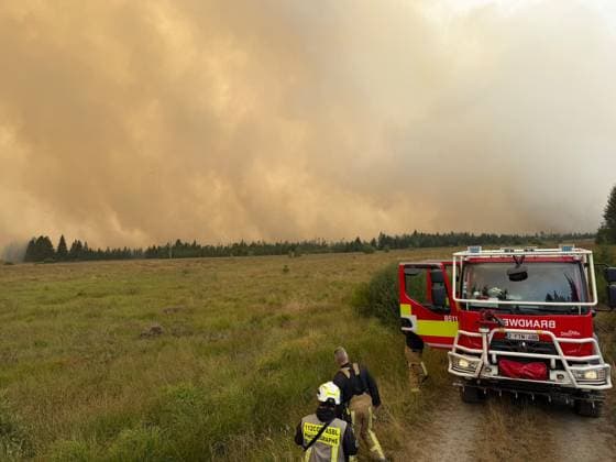 ATTENTION EDITORS - HANDOUT PICTURES - MANDATORY CREDIT - EDITORIAL USE ONLY - Handout pictured distributed shows Firemen in action as a fire rages in the Hautes Fagnes (High Fens) nature reserve, on Monday 17 August 2026. The fire started on August 14th and 2700 hectares (on a total of 4500) are impacted.  IMAGESxVHP 183602840