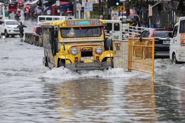 (260817) -- QUEZON CITY, Aug. 17, 2026 -- A jeepney drives through floodwater in Quezon City, the Philippines, on Aug. 17, 2026. The Philippine government has suspended in-person classes in Metro Manila and 12 other provinces as heavy rains from tropical cyclones and the southwest monsoon continue to batter the country, local media reported on Monday. The extreme rainfall has triggered severe flooding and landslides across the nation. The well-known flood-control corruption scandal has left key infrastructure unfinished or poorly maintained, further straining the country s disaster response, local media reported. ) THE PHILIPPINES-QUEZON CITY-SOUTHWEST MONSOON-FLOOD RouellexUmali 
