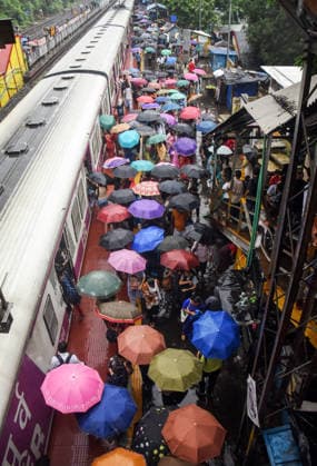 RECORD DATE NOT STATED Commuters Use Umbrellas Amid Heavy Rainfall at Kolkata Railway Station Kolkata West Bengal , Aug 17 (ANI): Commuters use umbrellas to shield themselves from rain while boarding local trains amid heavy rainfall at Bidhannagar Road railway station, in Kolkata on Monday. Kolkata West Bengal India Copyright: xANIx ANI_20260817149
