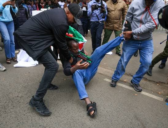 Demonstrators protest police conduct and disappearances in Kenya NAIROBI, KENYA - AUGUST 17: Police officers detain activists during a protest outside the National Police Service headquarters in Nairobi, Kenya, on August 17, 2026. Demonstrators gathered to protest cases of brutality and enforced disappearances, calling for the resignation of Kenya s Inspector General of Police Douglas Kanja and demanding investigations into unresolved cases involving missing persons. Lucas Mukasa Anadolu Nairobi Kenya. Editorial use only. Please get in touch for any other usage.  Copyright: x2026xAnadoluxLucasxMukasax