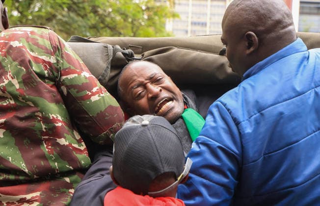 Demonstrators protest police conduct and disappearances in Kenya NAIROBI, KENYA - AUGUST 17: Police officers detain activists during a protest outside the National Police Service headquarters in Nairobi, Kenya, on August 17, 2026. Demonstrators gathered to protest cases of brutality and enforced disappearances, calling for the resignation of Kenya s Inspector General of Police Douglas Kanja and demanding investigations into unresolved cases involving missing persons. Lucas Mukasa Anadolu Nairobi Kenya. Editorial use only. Please get in touch for any other usage.  Copyright: x2026xAnadoluxLucasxMukasax