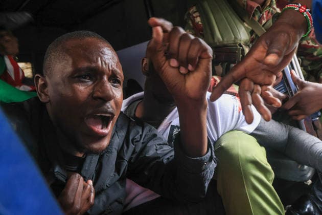 Demonstrators protest police conduct and disappearances in Kenya NAIROBI, KENYA - AUGUST 17: Police officers detain activists during a protest outside the National Police Service headquarters in Nairobi, Kenya, on August 17, 2026. Demonstrators gathered to protest cases of brutality and enforced disappearances, calling for the resignation of Kenya s Inspector General of Police Douglas Kanja and demanding investigations into unresolved cases involving missing persons. Lucas Mukasa Anadolu Nairobi Kenya. Editorial use only. Please get in touch for any other usage.  Copyright: x2026xAnadoluxLucasxMukasax