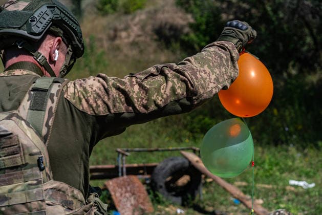 Khartiia brigade trains to counter FPV drones on Ukraine s frontline KHARKIV OBLAST, UKRAINE - AUGUST 17: Members of the air defense unit of the Khartiia Brigade demonstrate training against FPV drones in Kharkiv Oblast, Ukraine, on August 17, 2026. Soldiers attach balloons to FPV drones and practice shooting them down during the exercise. The training aims to improve the ability of air defense and infantry personnel to counter FPV drones in real combat situations along the front lines. Carlo Bravo Anadolu Kharkiv Ukraine. Editorial use only. Please get in touch for any other usage.  Copyright: x2026xAnadoluxCarloxBravox