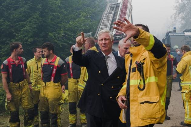 King Philippe - Filip of Belgium pictured at a visit on the field of from the command center in Sourbrodt, as fire rages in the Hautes Fagnes (High Fens) nature reserve, on Monday 17 August 2026. The fire started on August 14th and 3000 hectares (on a total of 4500) are impacted. POOL  NICOLASxLAMBERT 183612548
