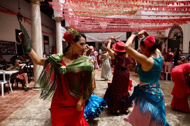 Scene at the 2026 Málaga Fair: Several women, dressed in traditional flamenco outfits, stroll through the Cortijo de Torres grounds during the Málaga Fair. August 17, 2026, in Málaga, Andalusia, Spain. The capital of the Costa del Sol celebrates its big week, during which locals and visitors gather to enjoy the festive atmosphere and the many activities the Feria has to offer. August 17, 2026, in Málaga, Andalusia, Spain Málaga, Andalusia, Spain Spain  Copyright: xÃlexxZeax 7718776