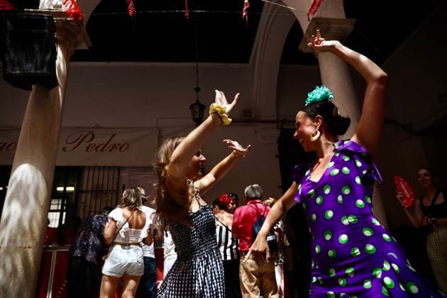 Scene at the 2026 Málaga Fair: Several women, dressed in traditional flamenco outfits, stroll through the Cortijo de Torres grounds during the Málaga Fair. August 17, 2026, in Málaga, Andalusia, Spain. The capital of the Costa del Sol celebrates its big week, during which locals and visitors gather to enjoy the festive atmosphere and the many activities the Feria has to offer. August 17, 2026, in Málaga, Andalusia, Spain Málaga, Andalusia, Spain Spain  Copyright: xÃlexxZeax 7718779