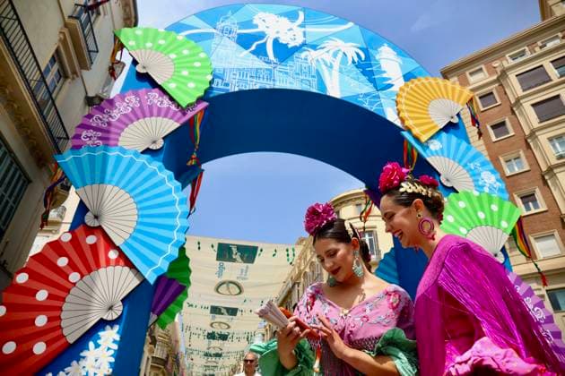Scene at the 2026 Málaga Fair: Several women, dressed in traditional flamenco dresses, stroll through the Cortijo de Torres grounds during the Málaga Fair. August 17, 2026, in Málaga, Andalusia, Spain. The capital of the Costa del Sol celebrates its big week, during which locals and visitors gather to enjoy the festive atmosphere and the many activities offered by the Feria. August 17, 2026, in Málaga, Andalusia, Spain Málaga, Andalusia, Spain Spain  Copyright: xÃlexxZeax 7718780