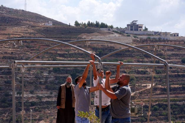 Three Palestinian families face restrictions in West Bank NABLUS, WEST BANK, PALESTINE - AUGUST 17: Israeli settlers have surrounded homes belonging to three Palestinian families for nine days in the Ras al-Ayn area of Qusra town, near Nablus, West Bank, Palestine on August 17, 2026. Access to food, water and basic necessities has been blocked for the homes, where approximately 13 Palestinians live. Issam H.s. Alasmar Anadolu Nablus West Bank. Editorial use only. Please get in touch for any other usage.  Copyright: x2026xAnadoluxIssamxH.s.xAlasmarx