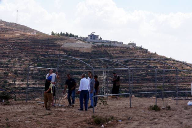 Three Palestinian families face restrictions in West Bank NABLUS, WEST BANK, PALESTINE - AUGUST 17: Israeli settlers have surrounded homes belonging to three Palestinian families for nine days in the Ras al-Ayn area of Qusra town, near Nablus, West Bank, Palestine on August 17, 2026. Access to food, water and basic necessities has been blocked for the homes, where approximately 13 Palestinians live. Issam H.s. Alasmar Anadolu Nablus West Bank. Editorial use only. Please get in touch for any other usage.  Copyright: x2026xAnadoluxIssamxH.s.xAlasmarx