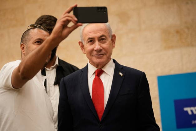 A man takes a selfie with Israeli Prime Minister Benjamin Netanyahu during the Likud party primary elections ahead of Israel s general election in October, in Jerusalem, Monday, August 17, 2026. Pool  ERX20260817202 OhadxZwigenberg