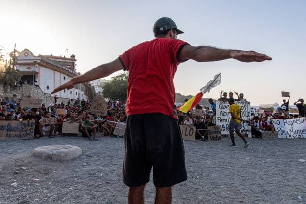 August 17, 2026, Ceuta, Spain: CEUTA, SPAIN Ã¢â‚¬ AUGUST 17, 2026: More than 100 migrants, most of them Moroccan, have been protesting for days in front of National Police vans during the daily food distribution provided by the Spanish Red Cross at TrampoloÂ­n Beach. Ã¢â‚¬oeNo asylum, no foodÃ¢â‚¬Â is the chant repeated by the migrants on the sand, while African migrants continue to stay in the temporary accommodation facilities set up on the Ceuta beach. Authorities are expected to clear the beach in the coming days and transfer the migrants to four reception facilities announced today by SpainÃ¢â‚¬â ¢s Minister for Migration, Elma Saiz. Ceuta Spain  - ZUMAq101 20260817_zna_q101_079 Copyright: xAntonioxSemperex