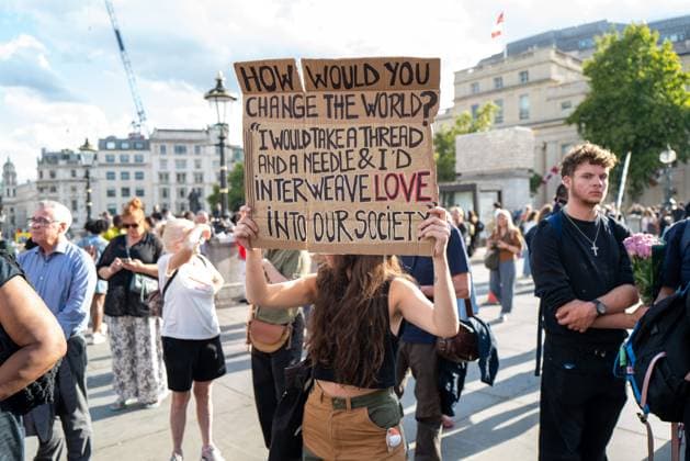 August 17, 2026, London, United Kingdom: A member of the public poses with a sign at the vigil for Professor Jason Arday in Trafalgar Square..A vigil was organised by the campaign group Stand Up to Racism, after Professor Jason Arday was found dead at his home. He had resigned from his position as professor of sociology of education at Cambridge, amid accusations of plagiarism, which he denied. London United Kingdom - ZUMAs197 20260817_aaa_s197_114 Copyright: xPhilxLewisx