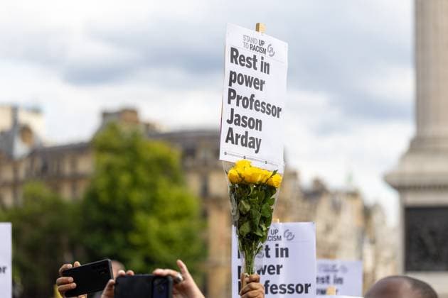 August 17, 2026, London, United Kingdom: Members of the public hold a sign with flowers, in support, at a vigil for Professor Jason Arday in Trafalgar Square..A vigil was organised by the campaign group Stand Up to Racism, after Professor Jason Arday was found dead at his home. He had resigned from his position as professor of sociology of education at Cambridge, amid accusations of plagiarism, which he denied. London United Kingdom - ZUMAs197 20260817_aaa_s197_117 Copyright: xPhilxLewisx