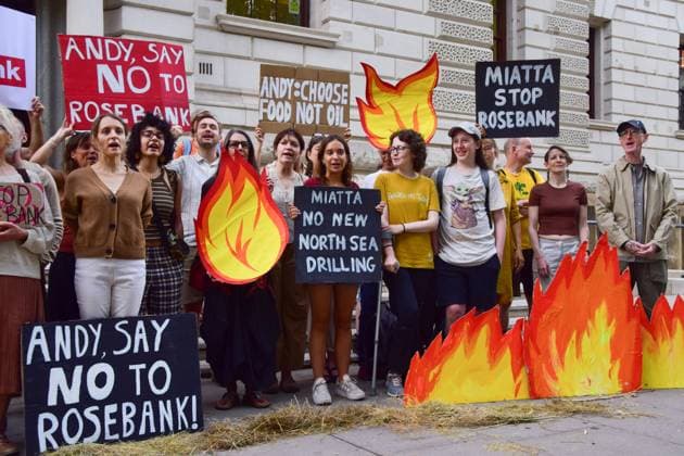 Anti-Rosebank Protests in London, UK - 17 Aug 2026 Climate activists from the group Fossil Free London stand among cardboard flames with placards calling on the UK Prime Minister Andy Burnham and the Energy Secretary Miatta Fahnbulleh to stop Rosebank during a protest against Rosebank outside the Treasury. Two separate groups staged protests in Westminster as the public consultation on the North Sea oil and gas field concludes. London United Kingdom Copyright: xVukxValcicx xSOPAxImagesx Vuk-Valcic-1442830