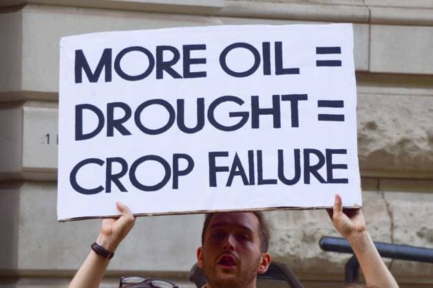 Anti-Rosebank Protests in London, UK - 17 Aug 2026 A climate activist from the group Fossil Free London holds a placard stating More oil equals drought equals crop failure during a protest against Rosebank outside the Treasury. Two separate groups staged protests in Westminster as the public consultation on the North Sea oil and gas field concludes. London United Kingdom Copyright: xVukxValcicx xSOPAxImagesx Vuk-Valcic-1442839