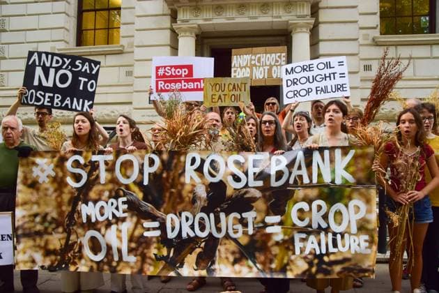 Anti-Rosebank Protests in London, UK - 17 Aug 2026 Climate activists from the group Fossil Free London hold placards and a banner opposed to fossil fuels and highlighting crop failures amidst the ongoing drought during a protest against Rosebank outside the Treasury. Two separate groups staged protests in Westminster as the public consultation on the North Sea oil and gas field concludes. London United Kingdom Copyright: xVukxValcicx xSOPAxImagesx Vuk-Valcic-1442842