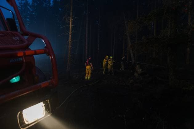Firefighters pictured in action, as a fire rages in the Hautes Fagnes (High Fens) nature reserve, on Tuesday 18 August 2026. The fire started on August 14th and 2700 hectares (on a total of 4500) are impacted.  NICOLASxLAMBERT 183633846