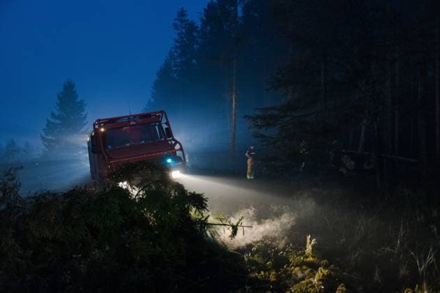 Firefighters pictured in action, as a fire rages in the Hautes Fagnes (High Fens) nature reserve, on Tuesday 18 August 2026. The fire started on August 14th and 2700 hectares (on a total of 4500) are impacted.  NICOLASxLAMBERT 183633847