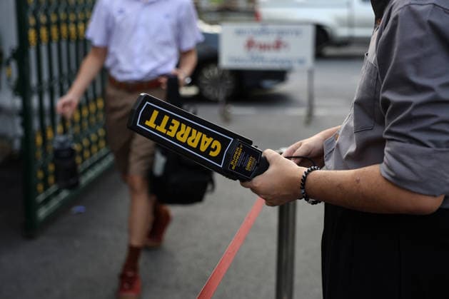 Thai schools tighten security after deadly shooting BANGKOK, THAILAND - AUGUST 18: A staff member holds a metal detector as students queue for weapons screening at the entrance to a school in Bangkok, Thailand, on August 18, 2026. Following a deadly school shooting on August 7, Thailand s government pledged tougher gun controls and made school safety a national priority, with schools stepping up weapons screening and other security measures. Valeria Mongelli Anadolu Banghok Thailand. Editorial use only. Please get in touch for any other usage.  Copyright: x2026xAnadoluxValeriaxMongellix