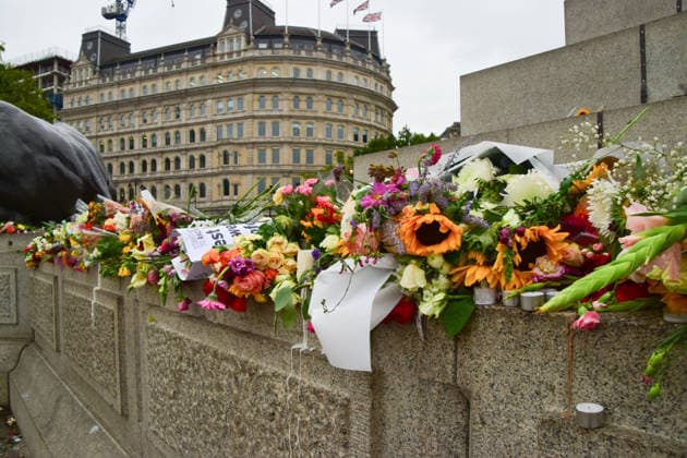 August 18, 2026, London, England, United Kingdom: Floral tributes for Jason Arday have been left at the base of Nelson s Column in Trafalgar Square following a vigil which took place the night before. The former University of Cambridge sociology professor died several days after he resigned following accusations of academic plagiarism and scrutiny of his personal claims. London United Kingdom - ZUMAv130 20260818_zip_v130_001 Copyright: xVukxValcicx