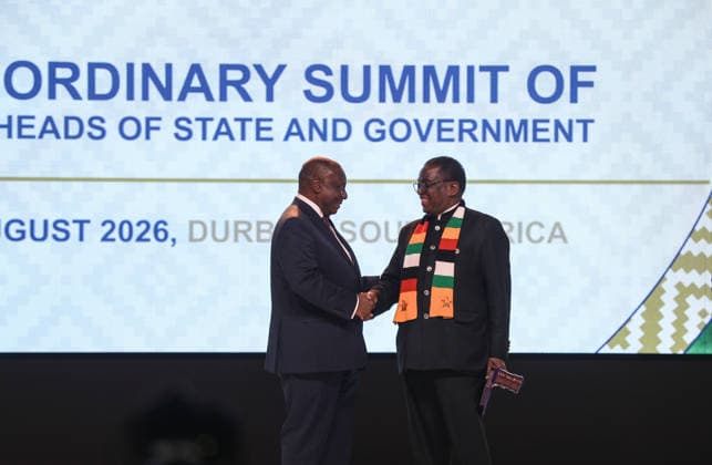 (260818) -- DURBAN, Aug. 18, 2026 -- South African President Cyril Ramaphosa (L) shakes hands with Zimbabwean President Emmerson Mnangagwa as Ramaphosa succeeds Mnangagwa as the Southern African Development Community (SADC) chairperson during the opening ceremony of the 46th Ordinary Summit of the SADC Heads of State and Government in Durban, South Africa, Aug. 17, 2026. The summit opened Monday in South Africa s coastal city of Durban, with calls for deeper regional integration and stronger cooperation to advance industrialization and economic development. TO GO WITH SADC summit opens in S. Africa s Durban with call for deeper regional integration ) SOUTH AFRICA-DURBAN-SADC-46TH SUMMIT-OPENING ChenxWei 