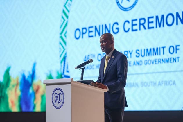 (260818) -- DURBAN, Aug. 18, 2026 -- Elias Magosi, executive secretary of the Southern African Development Community (SADC), speaks during the opening ceremony of the 46th Ordinary Summit of the SADC Heads of State and Government in Durban, South Africa, Aug. 17, 2026. The summit opened Monday in South Africa s coastal city of Durban, with calls for deeper regional integration and stronger cooperation to advance industrialization and economic development. TO GO WITH SADC summit opens in S. Africa s Durban with call for deeper regional integration ) SOUTH AFRICA-DURBAN-SADC-46TH SUMMIT-OPENING ChenxWei 
