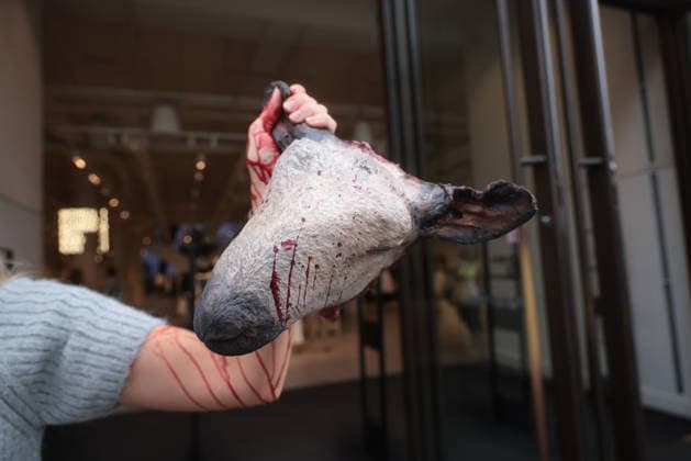 . 18 08 2026. London, United Kingdom. Peta Protest HM. Outside H&M s Regent Street store on Tuesday, a PETA supporter wearing bloodied faux-wool clothing displays a realistic severed sheep head holding a sign reading Here s the Rest of Your Wool Sweater! Wear Vegan! as the animal protection group calls on H&M to end its sale of wool.  xMartynxWheatleyx xi-Imagesx IIM-26951-0001