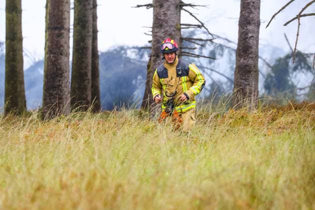 Firemen pictured on the site of the fire in the Hautes Fagnes (High Fens) nature reserve, on Tuesday 18 August 2026. The fire started on August 14th and 3000 hectares (on a total of 4500) are impacted.  BRUNOxFAHY 183665327