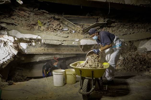 August 18, 2026, La Guaira, Venezuela (Bolivarian Republic of: LA GUAIRA, VENEZUELA Ã¢â‚¬ AUGUST 18, 2026: Emergency teams work among collapsed concrete slabs and twisted steel reinforcement as debris removal and body recovery operations continue at the disaster site in La Guaira, Venezuela, on August 18, 2026. Heavy machinery is being used to remove large sections of concrete and allow crews to search areas that remain difficult to access, as rescue and recovery efforts continue following the earthquakes that struck the region. La Guaira Venezuela (Bolivarian Republic of  - ZUMAq101 20260818_zna_q101_025 Copyright: xMarioxFloresx