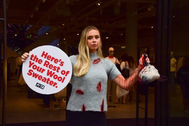 August 18, 2026, London, England, United Kingdom: A PETA activist wearing a faux wool top covered in fake blood holds an artificial severed sheep s head and a placard reading Here s the Rest of Your Wool Sweater outside the H&M store on Regent Street. The action is part of the animal rights group s ongoing campaign calling on H&M to stop selling wool products. London United Kingdom  - ZUMAv130 20260818_zip_v130_029 Copyright: xVukxValcicx