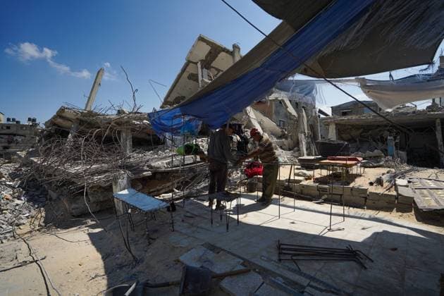 Gaza residents salvage metal from destroyed homesGaza residents salvage metal from destroyed homes KHAN YOUNIS, GAZA STRIP, PALESTINE, AUGUST 18, 2026: Palestinians salvage metal from the rubble of destroyed homes in Khan Younis for reuse in making tents and other items needed for daily life, amid shortages of materials and limited resources in the Gaza Strip. KHAN YOUNIS Palestine, State of Copyright: x xRamzixAbuxAmerx xJNAxPressx