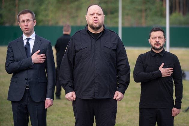 Prime Minister of Ukraine Sergii Koretskyi, Speaker of the Verkhovna Rada of Ukraine Ruslan Stefanchuk and President of Ukraine Volodymyr Zelenskyy (L to R) participate in the solemn reburial ceremony of Colonel Yevhen Konovalets, first head of the Organisation of Ukrainian Nationalists (OUN) and colonel of the Army of the Ukrainian People’s Republic (UNR), at the National Military Memorial Cemetery in Kyiv region, Ukraine, August 18, 2026. On August 11, 2026, Konovalets’ remains were exhumed at Crooswijk General Cemetery in Rotterdam, the Netherlands, where they had rested since his assassination by a Soviet agent in May 1938. (Photo by Danylo Antoniuk Ukrinform) Remains of OUN leader Yevhen Konovalets reburied at National Military Memoria  Copyright: xDanyloxAntoniukx