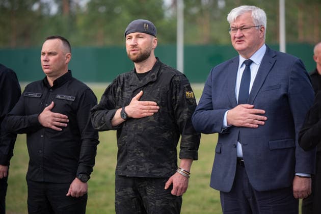 Minister of Internal Affairs of Ukraine Ivan Vyhivskyi, Acting Minister of Defence of Ukraine Yevhenii Khmara and Acting Minister of Foreign Affairs of Ukraine Andrii Sybiha (L to R) participate in the solemn reburial ceremony of Colonel Yevhen Konovalets, first head of the Organisation of Ukrainian Nationalists (OUN) and colonel of the Army of the Ukrainian People’s Republic (UNR), at the National Military Memorial Cemetery in Kyiv region, Ukraine, August 18, 2026. On August 11, 2026, Konovalets’ remains were exhumed at Crooswijk General Cemetery in Rotterdam, the Netherlands, where they had rested since his assassination by a Soviet agent in May 1938. (Photo by Danylo Antoniuk Ukrinform) Remains of OUN leader Yevhen Konovalets reburied at  Copyright: xDanyloxAntoniukx