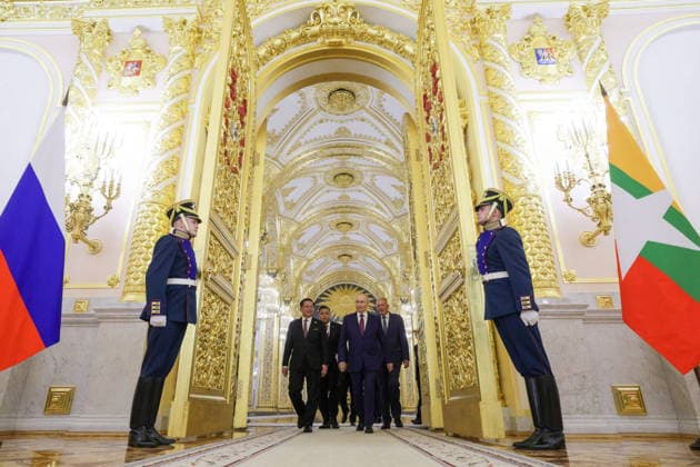 RUSSIA, MOSCOW - AUGUST 18, 2026: Vladimir Putin, President of Russia (2nd R back), and Min Aung Hlaing, President of Myanmar (L back), enter the hall for a working breakfast as part of their meeting at the Moscow Kremlin. Gavriil Grigorov Russian Presidential Press and Information Office TASS  96328024