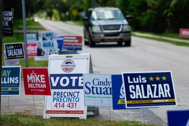 August 18, 2026, Tampa, Florida, USA: A vehicle drives past a plethora of election signs during primary day outside of the Cuban Civic Club on Tuesday, Aug. 18, 2026, in Tampa. Tampa USA - ZUMAs70_ 20260818_zan_s70_062 Copyright: xJeffereexWoox