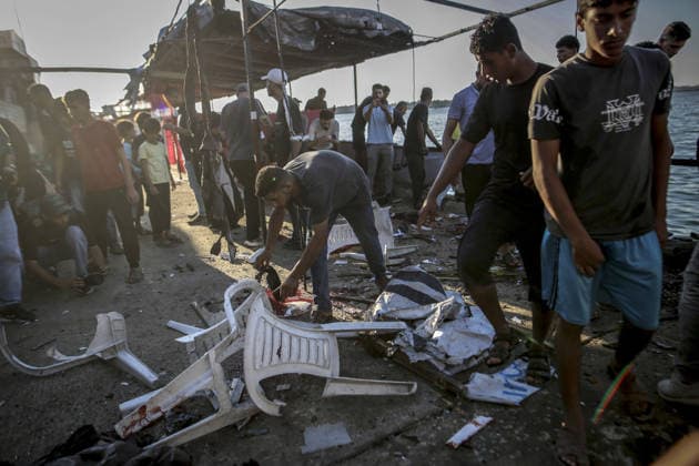 Israeli drone strike on crowded Gaza cafe kills 6 Palestinians GAZA CITY, GAZA, PALESTINE - AUGUST 18: (EDITORS NOTE: Image depicts graphic content) Palestinians inspect at destroyed beachfront cafe in Gaza City, Gaza, Palestine on August 18, 2026, following an Israeli airstrike that killed at least six people, including a child, and injured more than 12 others. The attack on the civilian gathering spot occurred despite recent calls from U.S. President Donald Trump urging Israel to halt its military operations across the Gaza Strip, as local rescue teams worked to retrieve victims from the damaged structure. Saeed M. M. T. Jaras Anadolu Gaza City Gaza. Editorial use only. Please get in touch for any other usage.  Copyright: x2026xAnadoluxSaeedxM.xM.xT.xJarasx