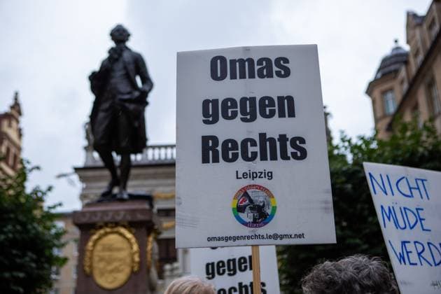 August 18, 2026, Leipzig, Saxony, Germany: LEIPZIG, GERMANY - AUGUST 18, 2026: Demonstrators gathered at the Naschmarkt in LeipzigÃ¢â‚¬â ¢s city centre to protest against an Alternative for Germany (AfD) campaign event being held at the historic Alte HandelsboÂ¶rse. Around 350 people took part in the demonstration against the far-right party, carrying numerous signs and banners expressing their opposition to the AfD and its political agenda. Leipzig Germany  - ZUMAq101 20260818_zna_q101_149 Copyright: xMariaxCastrox
