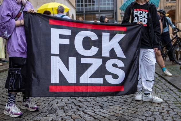 August 18, 2026, Leipzig, Saxony, Germany: LEIPZIG, GERMANY - AUGUST 18, 2026: Demonstrators gathered at the Naschmarkt in LeipzigÃ¢â‚¬â ¢s city centre to protest against an Alternative for Germany (AfD) campaign event being held at the historic Alte HandelsboÂ¶rse. Around 350 people took part in the demonstration against the far-right party, carrying numerous signs and banners expressing their opposition to the AfD and its political agenda. Leipzig Germany  - ZUMAq101 20260818_zna_q101_151 Copyright: xMariaxCastrox