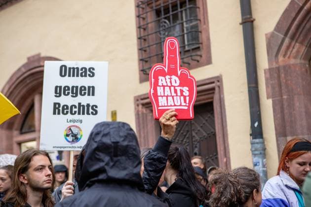 August 18, 2026, Leipzig, Saxony, Germany: LEIPZIG, GERMANY - AUGUST 18, 2026: Demonstrators gathered at the Naschmarkt in LeipzigÃ¢â‚¬â ¢s city centre to protest against an Alternative for Germany (AfD) campaign event being held at the historic Alte HandelsboÂ¶rse. Around 350 people took part in the demonstration against the far-right party, carrying numerous signs and banners expressing their opposition to the AfD and its political agenda. Leipzig Germany  - ZUMAq101 20260818_zna_q101_152 Copyright: xMariaxCastrox