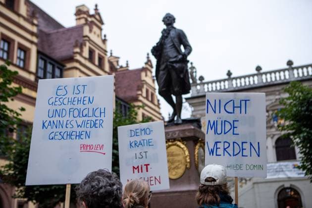 August 18, 2026, Leipzig, Saxony, Germany: LEIPZIG, GERMANY - AUGUST 18, 2026: Demonstrators gathered at the Naschmarkt in LeipzigÃ¢â‚¬â ¢s city centre to protest against an Alternative for Germany (AfD) campaign event being held at the historic Alte HandelsboÂ¶rse. Around 350 people took part in the demonstration against the far-right party, carrying numerous signs and banners expressing their opposition to the AfD and its political agenda. Leipzig Germany  - ZUMAq101 20260818_zna_q101_154 Copyright: xMariaxCastrox