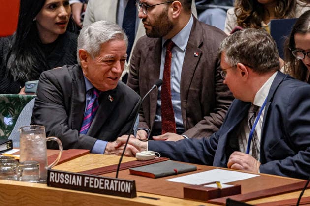 August 18, 2026, New York, New York, United States: ELOY ALFARO DE ALBA (L), Permanent Representative of Panama to the United Nations, shakes hands with a representative of the Russian Federation ahead of a UN Security Council meeting on the situation in Libya, at UNHQ. New York United States  - ZUMAo116 20260818_znp_o116_034 Copyright: xBiancaxOterox