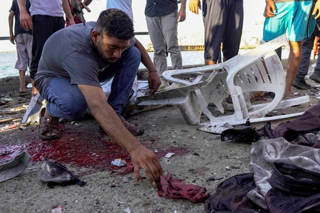 Gaza City Seashore Shelling A Palestinian man inspects bloodstains and debris following shelling along the seashore in Gaza City, Palestinian Territories on August 18, 2026 At least six Palestinians, including a child, were killed and 10 others injured on Tuesday in an Israeli airstrike that hit a cafe in the seaport area west of Gaza City, according to a medical source. Gaza Gaza Strip Palestinian Territories Copyright: xMohammedxAlxQumsanx