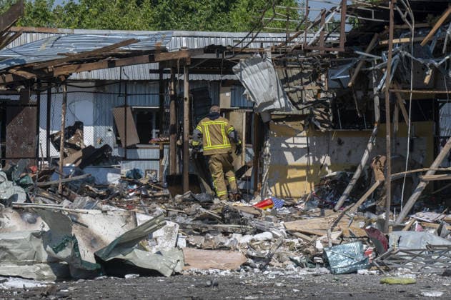 Aftermath of Russian attack in Kharkiv KHARKIV, UKRAINE - AUGUST 18: A view of destruction after the Russians fired two Banderole missiles at a cafe and a store in the center of the village of Pechenigi in the Kharkiv region in Russia, on August 18, 2026. Ten civilians were killed, and at least 18 were injured. Seven cars were burned, 15 were damaged, and 10 private homes, a post office, and five stores were damaged. Serhii Masin Anadolu Kharkiv Ukraine. Editorial use only. Please get in touch for any other usage.  Copyright: x2026xAnadoluxSerhiixMasinx