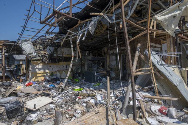 Aftermath of Russian attack in Kharkiv KHARKIV, UKRAINE - AUGUST 18: A view of destruction after the Russians fired two Banderole missiles at a cafe and a store in the center of the village of Pechenigi in the Kharkiv region in Russia, on August 18, 2026. Ten civilians were killed, and at least 18 were injured. Seven cars were burned, 15 were damaged, and 10 private homes, a post office, and five stores were damaged. Serhii Masin Anadolu Kharkiv Ukraine. Editorial use only. Please get in touch for any other usage.  Copyright: x2026xAnadoluxSerhiixMasinx