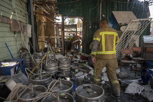 Aftermath of Russian attack in Kharkiv KHARKIV, UKRAINE - AUGUST 18: A view of destruction after the Russians fired two Banderole missiles at a cafe and a store in the center of the village of Pechenigi in the Kharkiv region in Russia, on August 18, 2026. Ten civilians were killed, and at least 18 were injured. Seven cars were burned, 15 were damaged, and 10 private homes, a post office, and five stores were damaged. Serhii Masin Anadolu Kharkiv Ukraine. Editorial use only. Please get in touch for any other usage.  Copyright: x2026xAnadoluxSerhiixMasinx